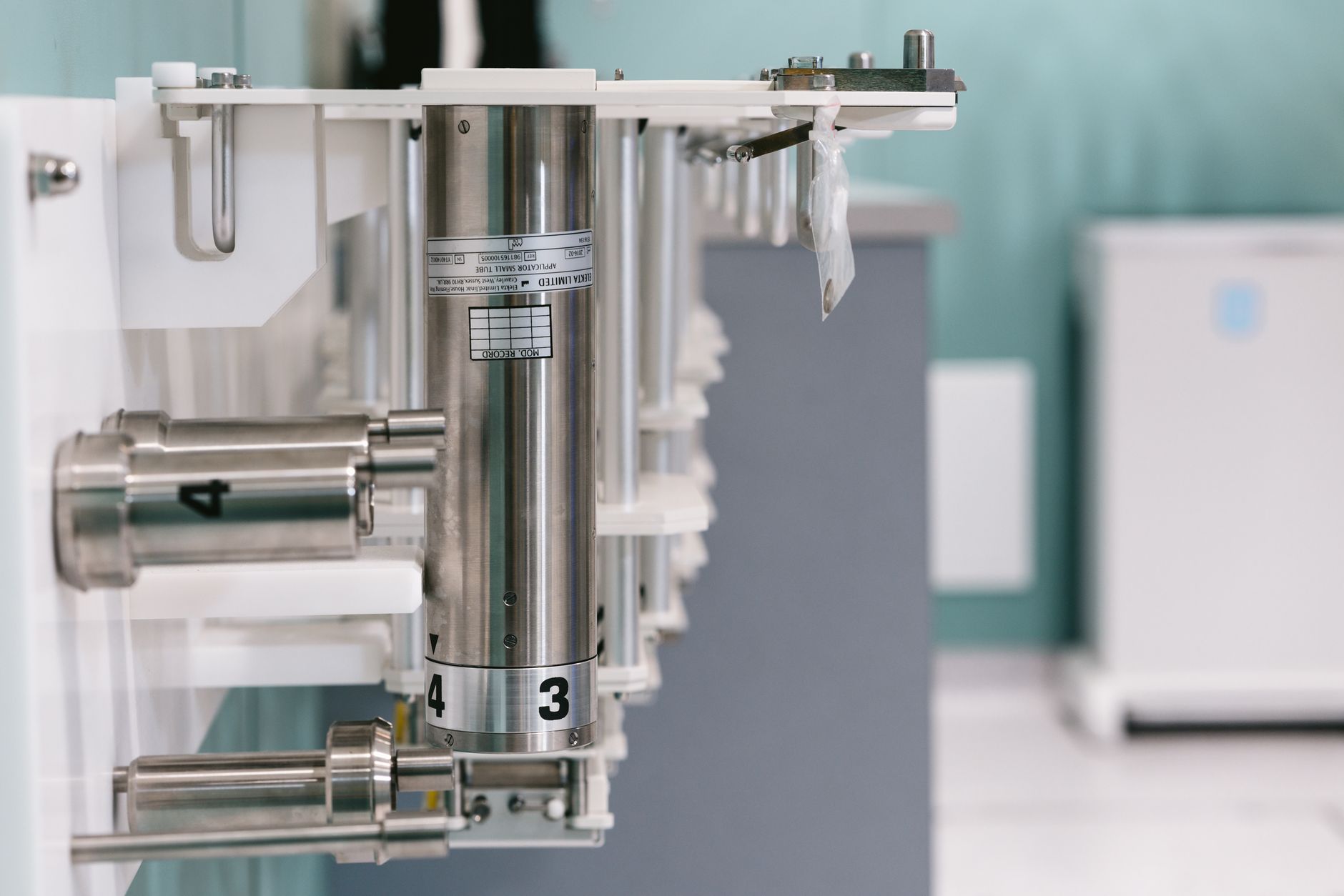 Close-up of metal laboratory apparatus in a sterile research lab environment.