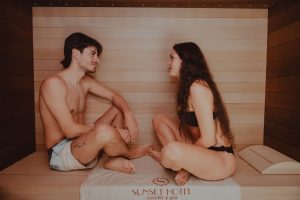 A couple enjoying a relaxing time in a sauna at a luxury spa hotel in Sicily, Italy.