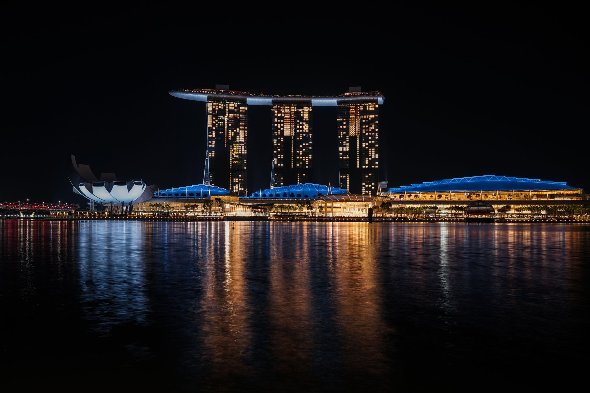 Beautiful nighttime view of Marina Bay Sands with water reflections in Singapore.